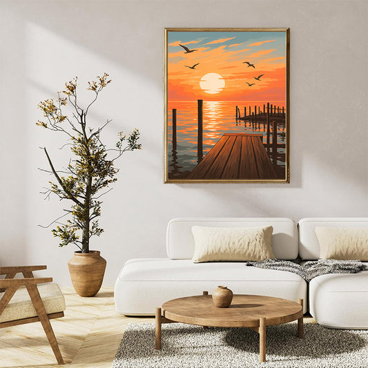 A tranquil sunset scene depicts a wooden doc